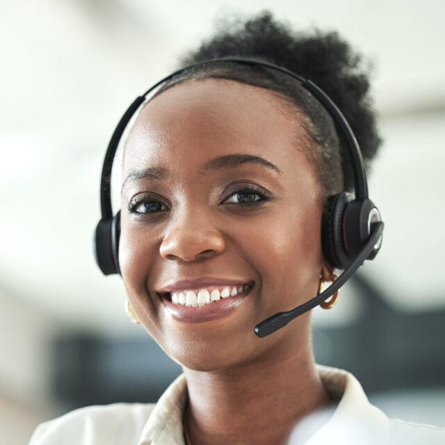 Black woman, call center portrait and phone consultation with a smile in a office with work. Telemarketing, consulting job and African female employee at a contact us and customer service company.